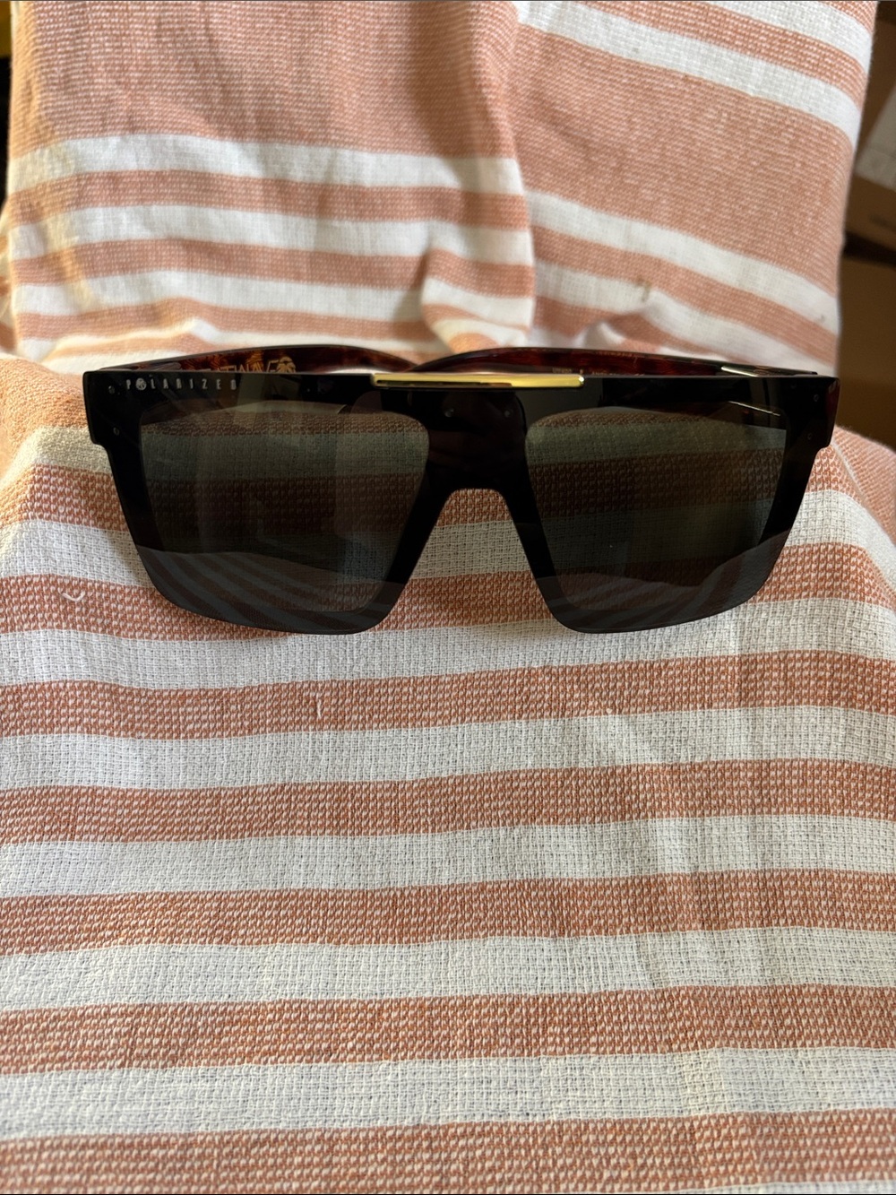 Heatwave Quatro Black Polarized Shield Sunglasses with Gold Bridge Accent
